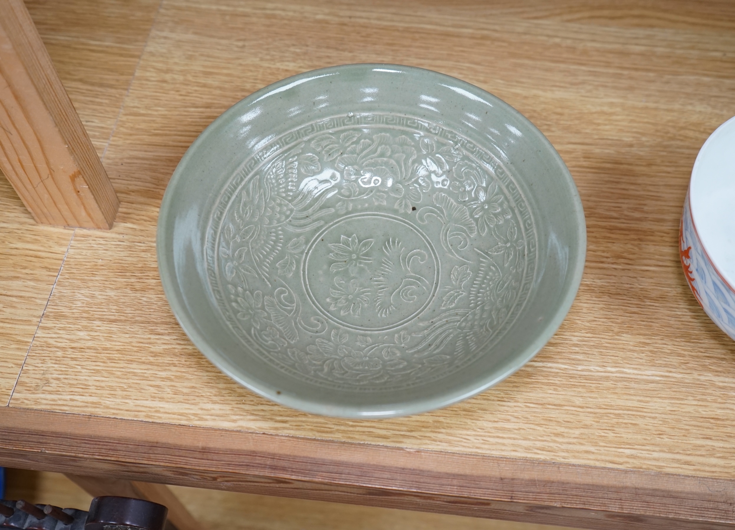 A Chinese Celadon glazed bowl and another, largest 19.5cm diameter. Condition - some wear